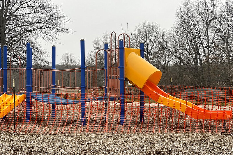 This Tuesday, March 24, 2020, photo provided by the City of Hannibal, Mo., shows Parks and Recreation Department roped off playground equipment at Huckleberry Park. The city is either removing or roping off all playground equipment, and is removing picnic tables from parks prevent the spread of coronavirus. (Photo by Mary Lynne Richards/The City of Hannibal via AP)