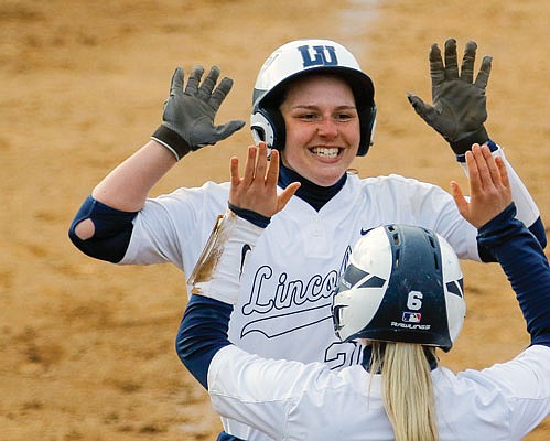 Lincoln's Kendra Holt high-fives teammate Emily Williams after the two each scored a run during a game against Missouri S&T this season at LU Softball Field.