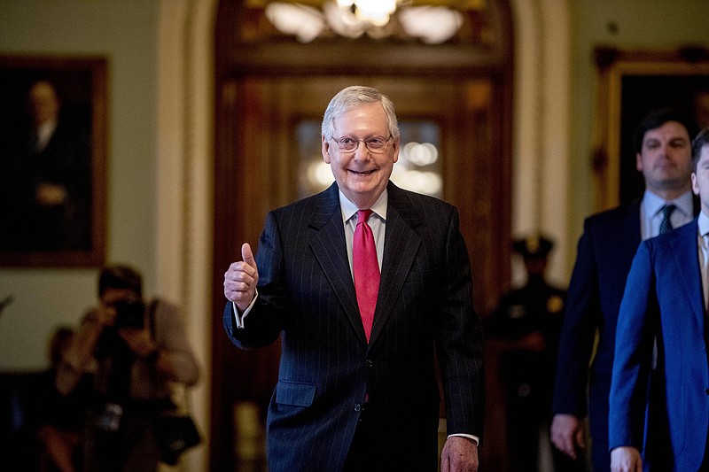 Senate Majority Leader Mitch McConnell of Ky. gives a thumbs up as he leaves the Senate chamber on Capitol Hill in Washington, Wednesday, March 25, 2020, where a deal has been reached on a coronavirus bill. The 2 trillion dollar stimulus bill is expected to be voted on in the Senate Wednesday.