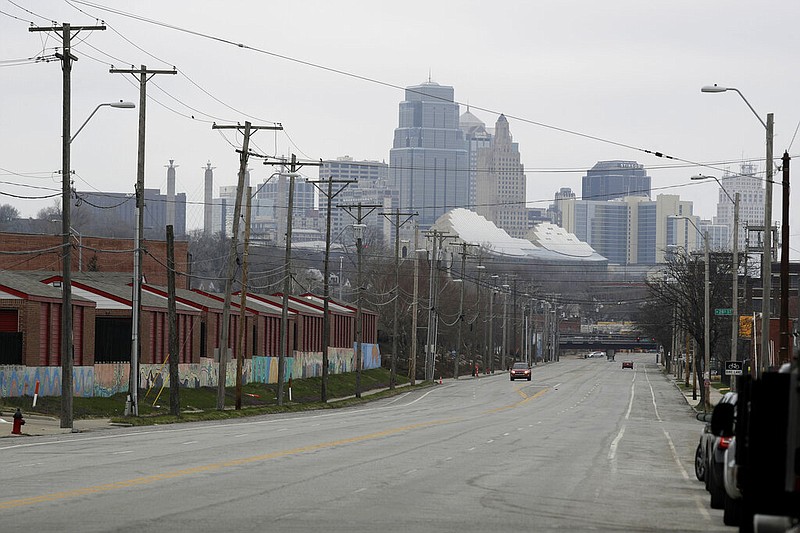 Light traffic is seen on a major street leading out of downtown Kansas City, Mo. during rush hour Tuesday, March 24, 2020 on the first day of a stay-at-home order. Kansas City and surrounding counties instituted a 30-day mandatory stay-at-home order in an effort to stem the spread of the coronavirus. (AP Photo/Charlie Riedel)