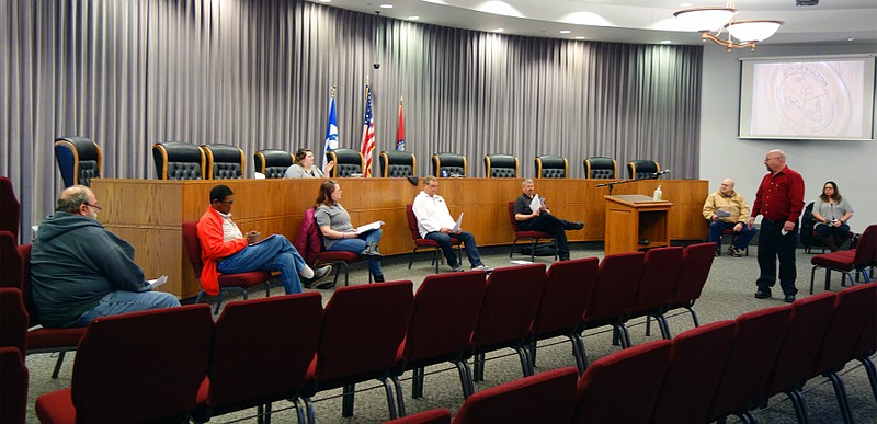 Members of Fulton's municipal government practice social distancing during an emergency meeting Tuesday evening. The meeting formalized emergency measures already in place in Fulton, including the suspension of utility shutoffs.