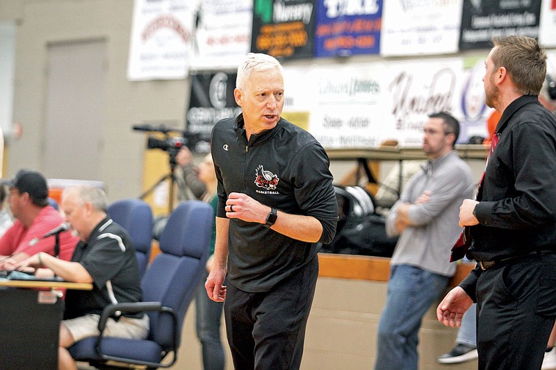 Eugene coach Craig Engelbrecht looks toward his bench during the second half of the Eagles' Class 2 quarterfinal game against Milan earlier this month at Moberly Area Community College in Moberly.