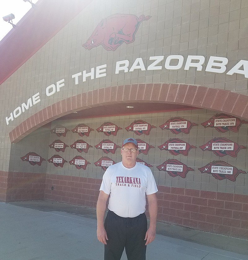 Scott Black stands in front of the Arkansas High School field house. Black has been a life-long fan of the Razorbacks and high school sports in Texarkana.
