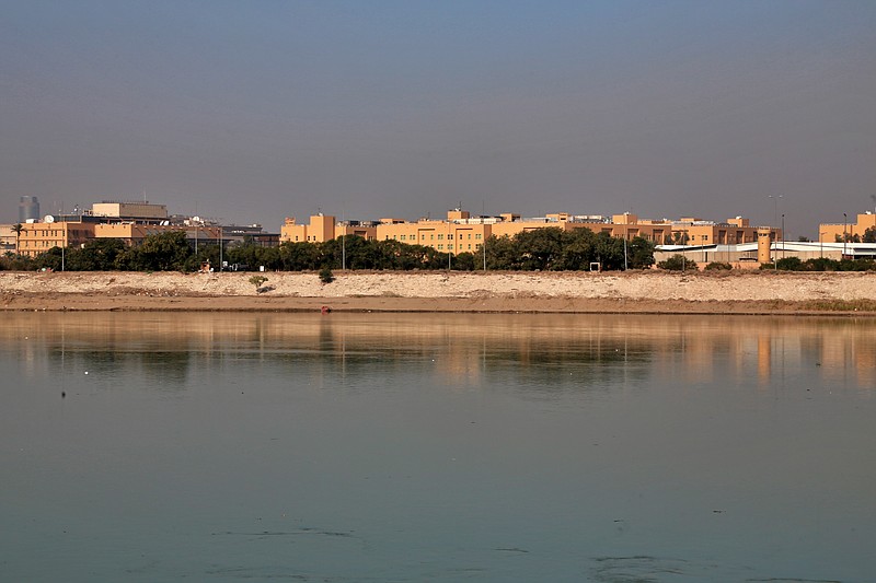 FILE - In this Friday, Jan. 3, 2020, file photo, the U.S. Embassy is seen across the Tigris River in Baghdad, Iraq. Iraq's military says two rockets hit Baghdad's heavily fortified Green Zone, the seat of the government and home to the U.S. Embassy. (AP Photo/Khalid Mohammed, File)