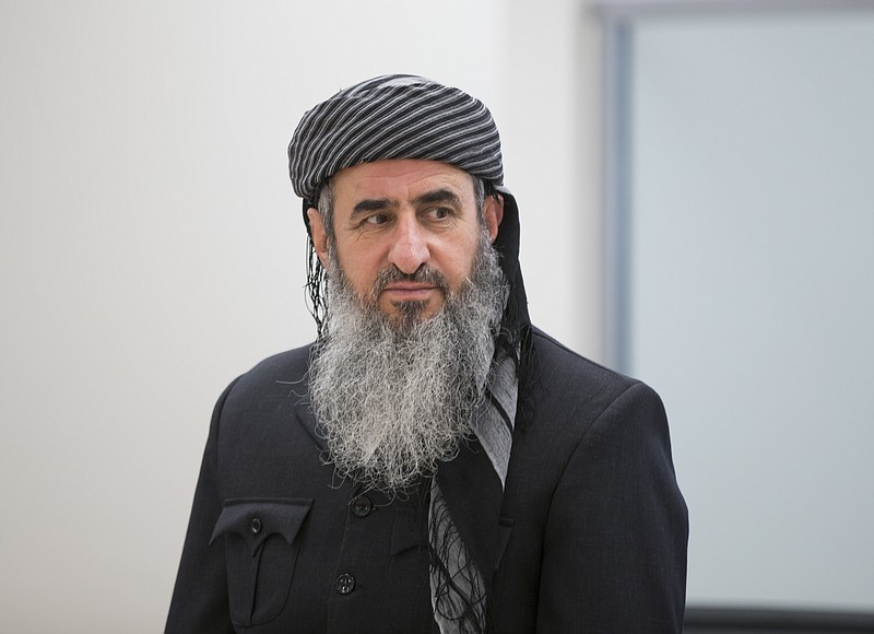 FILE - This June 13, 2016, file photo shows Najmuddin Ahmad Faraj, better known as Mullah Krekar attends a court hearing, at Oslo District Court in Oslo, Norway. A Norway-based Muslim cleric has been extradited to Italy where he has been sentenced to 12 years in jail for planning terror. The Norwegian justice minister said Italy felt it was the right time. Norway has long wanted to get him out of the country and earlier this year decided he could be extradited. He opposed that, fearing he would be extradited to Iraq. Most recently, he also expressed fears that Italy had become the epicenter of the outbreak of the new coronavirus. (Terje Pedersen/NTB Scanpix via AP, File)