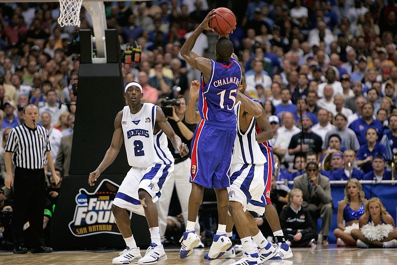 In this Monday, April 7, 2008, file photo, Kansas' Mario Chalmers shoots a three pointer to take the game in to overtime against Memphis during the championship game at the NCAA college basketball Final Four in San Antonio. Kansas defeated Memphis 75-68 in overtime. (AP Photo/Mark Humphrey, File)
