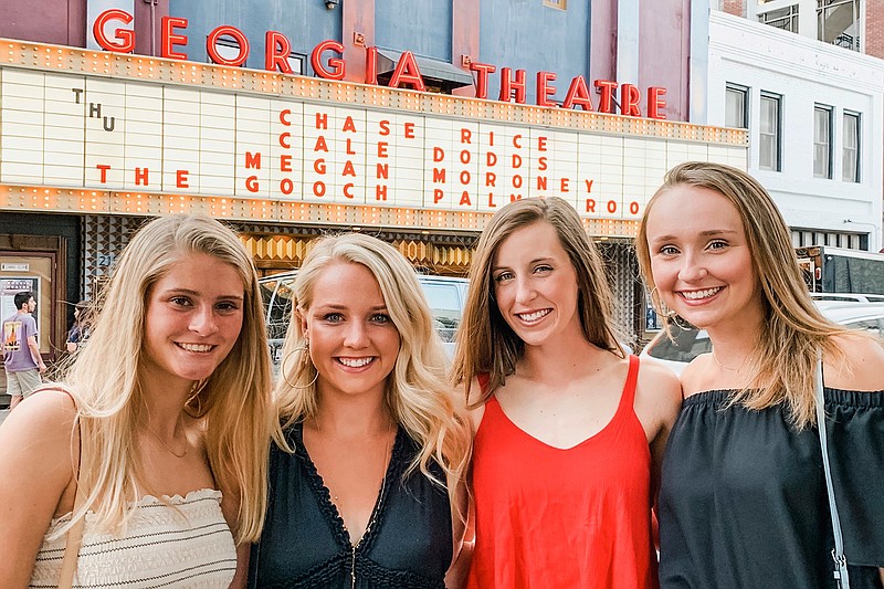 In this April 11, 2019, photo, provided by Davis Thompson, University of Georgia student-athletes and roommates from left: Ashley Andersen, Morgan Coppoc, Tyler Armistead and Dalaney Hans pose before attending a concert together in Athens, Georgia. Georgia tennis player Morgan Coppoc finds herself in a situation similar to so many other college athletes across the country, back home and hundreds of miles away from campus, lost without her routine and her teammates. Still, she is regularly hearing from her coaches with both updates for the entire team with latest details about the coronavirus and individual check-ins. The UGA counseling also office got in touch with Coppoc immediately and then again to offer sessions by phone that she would have typically attended in person. (Davis Thompson via AP)