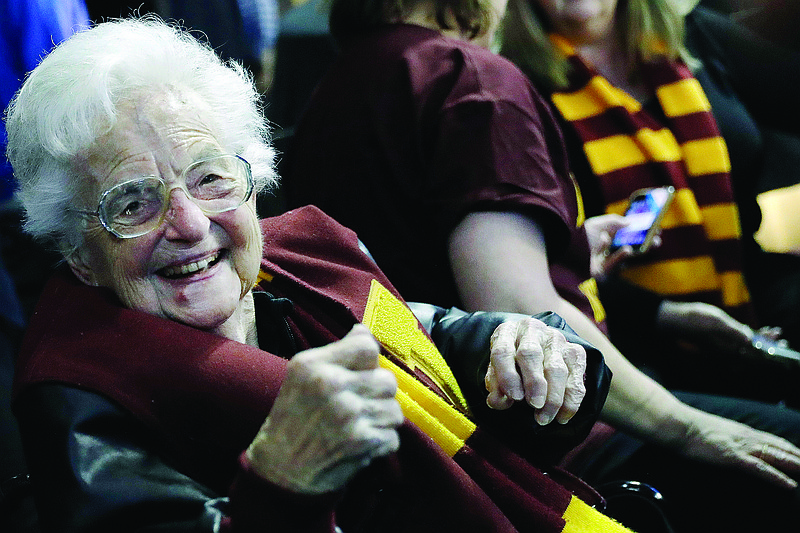 In this March 22, 2018, file photo, Sister Jean Dolores Schmidt sits with other Loyola-Chicago fans during the first half of a regional semifinal game against Nevada in Atlanta.