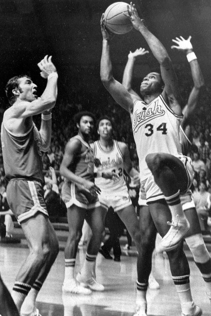 In this Jan. 23, 1971, file photo, Notre Dame's Austin Carr goes to the basket as UCLA's Steve Patterson, left, defends, during a college basketball game in South Bend, Ind. Carr had 46 points in an 89-82 victory. Carr played for Notre Dame in an era when prolific scorers dominated college basketball. It wasn't until Carr scored a still-standing NCAA Tournament-record 61 points against Ohio in the first round in 1970 that, in his mind, he started to separate himself. (AP Photo/Richard Horowitz, File)