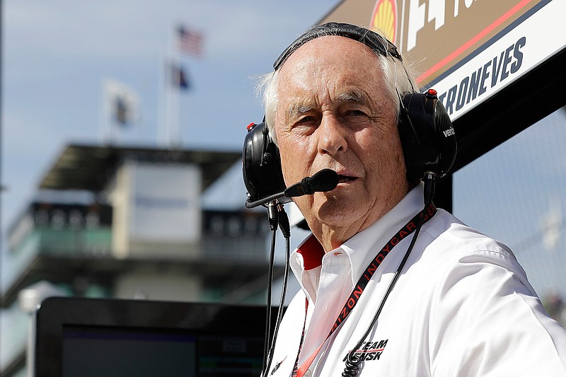  In this May 16, 2017, file photo, car owner Roger Penske watches practice for the Indianapolis 500 auto race at Indianapolis Motor Speedway, in Indianapolis. Penske, at 83 and considered high risk to the coronavirus as a 2017 kidney transplant recipient, still makes the daily three-minute commute to his Bloomfield Hills, Mich, office. He works 12 or more hours a day from his conference room at Penske Corp., which has a skeleton crew all practicing social distancing. Penske also had the small matter of planning his first Indianapolis 500. (AP Photo/Darron Cummings, File)