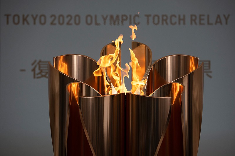The Olympic Flame burns on March 24 during a ceremony in Fukushima City, northern Japan. 