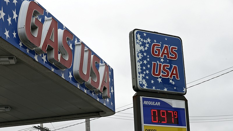 Gas USA is selling gas for 97.9 cents a gallon, Monday, March 30, 2020, in Cleveland. Oil started the year above $60 and has plunged on expectations that a weakened economy will burn less fuel. The world is awash in oil, meanwhile, as producers continue to pull more of it out of the ground. (AP Photo/Tony Dejak)
