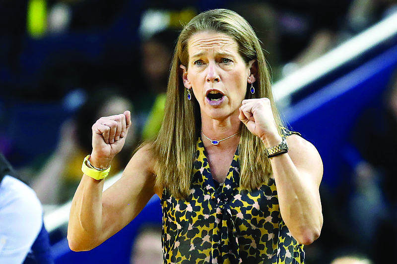 In this Jan. 5 file photo, Michigan head coach Kim Barnes Arico directs her team during the second half of a game against Michigan State in Ann Arbor, Mich.