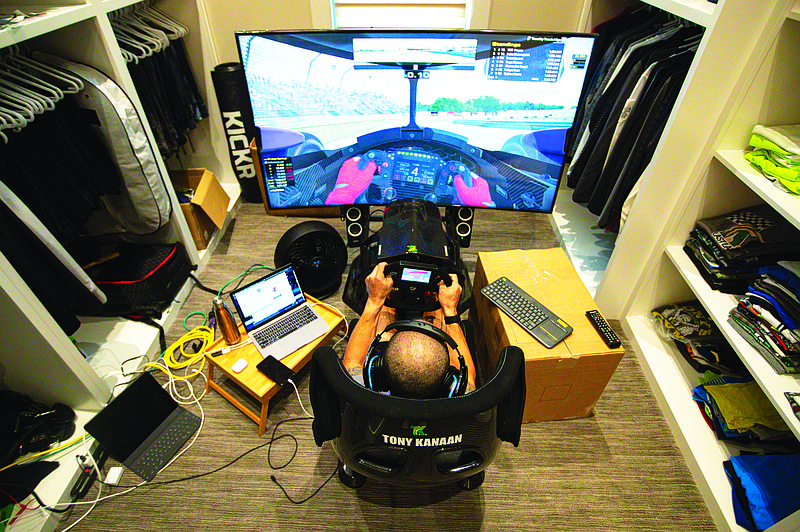 IndyCar driver Tony Kanaan practices on his racing simulator last Saturday in his home in Indianapolis. Kanaan, along with other IndyCar drivers and NASCAR's Jimmie Johnson, competed in the series' inaugural virtual racing event Saturday.