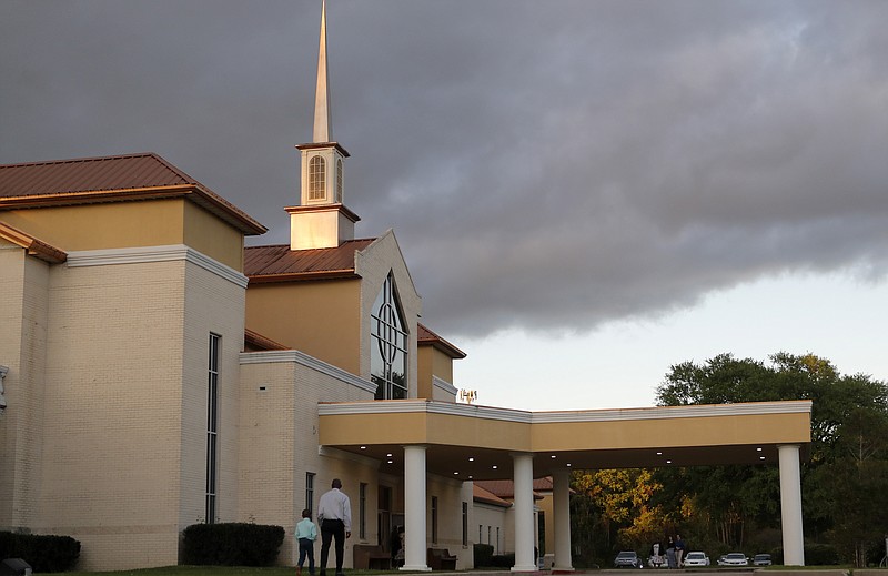 Congregants arrive for an evening service at the Life Tabernacle Church in Central, La., Tuesday, March 31, 2020. Pastor Tony Spell says he will keep violating a ban on gatherings put in place to control the spread of the coronavirus because God told him to. (AP Photo/Gerald Herbert)