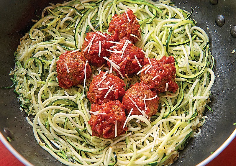Rocco DiSpirito's mother's meatballs were legendary at the now defunct Rocco's on 22nd Street, a red-sauce restaurant in New York City. He gives the meatballs a keto twist by using cheese crisps instead of breadcrumbs and serving them with zoodles instead of pasta. (Nate Guidry/Pittsburgh Post-Gazette/TNS)