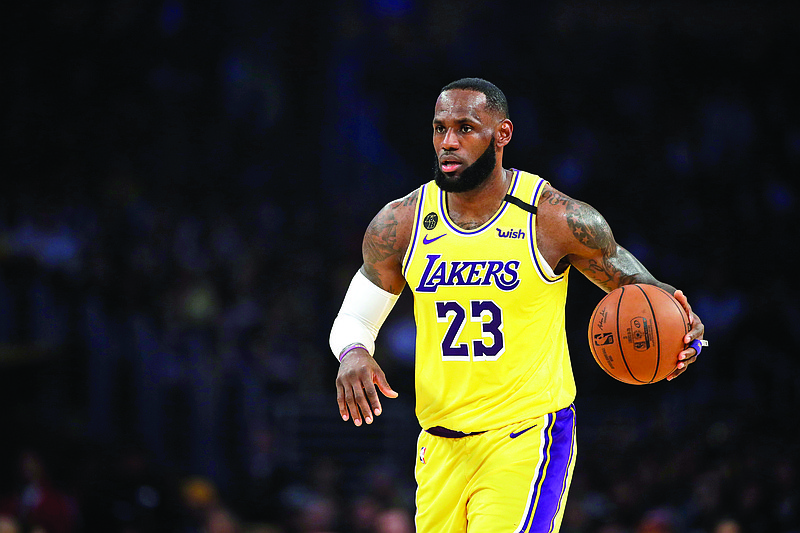 LeBron James of the Lakers dribbles during the first half of a game last month against the Nets in Los Angeles.