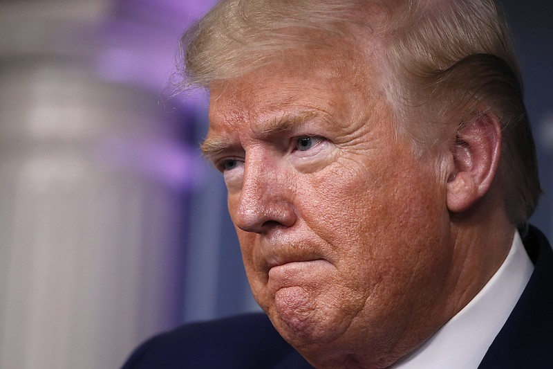 President Donald Trump listens during a briefing about the coronavirus in the James Brady Press Briefing Room of the White House, Wednesday, April 1, 2020, in Washington. (AP Photo/Alex Brandon)