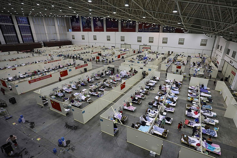 This Feb. 18, 2020, file photo, shows a temporary hospital converted from an exhibition center in Wuhan in central China's Hubei province. The hospital, one of the dozen of its kind built in Wuhan, hosted COVID-19 patients with mild symptoms. (Chinatopix via AP, File)