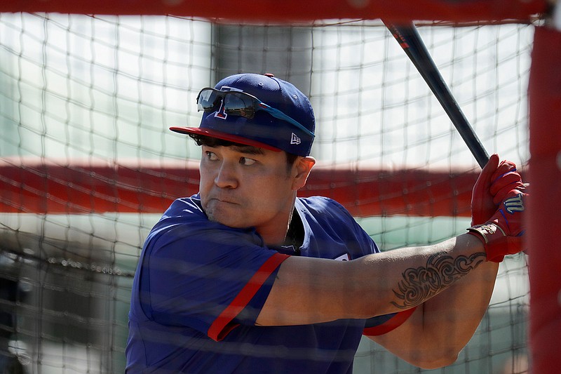 Texas Rangers' Shin-Soo Choo bats during spring training baseball practice Monday, Feb. 17, 2020, in Surprise, Ariz. (AP Photo/Charlie Riedel)