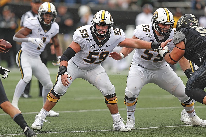 Missouri offensive lineman Case Cook plays against Vanderbilt in the first half of a game last season in Nashville, Tenn. Players like Cook are permitted to use the team's facilities in Columbia to receive treatment for injuries.