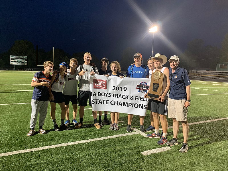 The Trinity Christian School track team poses after winning state last season. Pictured from left, are Kendall Jones, Eli Youngblood, Evan Miller, Sean Brown, Cole Guise, Macy McClean, Hunter Phillips, Jaycee Leeper, Rhett Nelson and head coach Russ Nelson. (Submitted photo)
