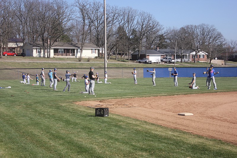 <p>File</p><p>The Russellville baseball team warms up in practice March 11. With schools delayed across the area, Indians athletes are in limbo as they wait to return to their suspended season.</p>