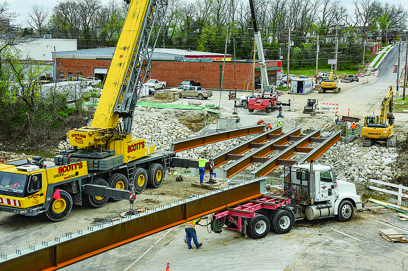 Several local contractors worked together Tuesday morning, April 7, 2020, to set the steel girders for the new bridge over Wears Creek on Dunklin Street. There were eight girders, made locally by DeLong's Steel, Inc.