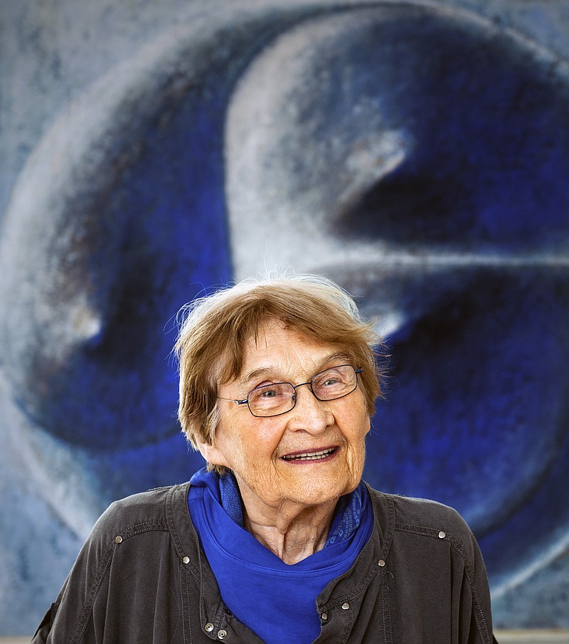 FILE - In this July 14, 2014 file photo, influential Czech glass artist Jaroslava Brychtova smiles in Zelezny Brod, Czech Republic. Brychtova, a Czech glass artist whose sculptures and objects created together with her late husband Stanislav Libensky gained recognition worldwide has died. She was 95. Brychtova died on Wednesday, April 8, 2020 in a hospital In Jablonec nad Nisou, sculpturer Pavel Karous who assisted her on one of her last glass works said on Facebook.(Radek Petrasek/CTK via AP, file)