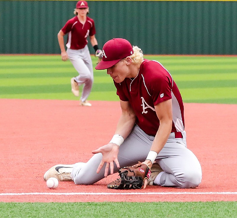 Arkansas High's first baseman Cody Adcock gets low to catch a ground ball for an out against a White Hall batter during the Class 5A state tournament on May 10, 2019, in Benton, Ark. 