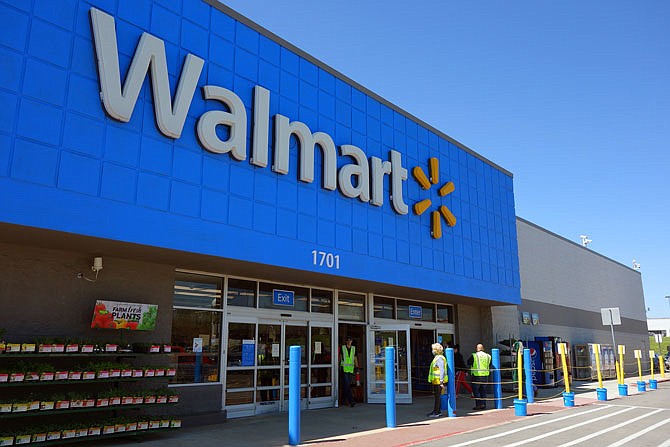 Following Gov. Mike Parson's stay-at-home order, Walmart has begun limiting how many shoppers may enter the store at a time. A queueing area out front is taped out at 6-foot intervals, to remind people to remain the recommended distance from each other while waiting for their turn inside.
