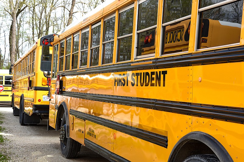 This April 2020 photo shows parked school buses in Jefferson City operated by First Student Transportation.