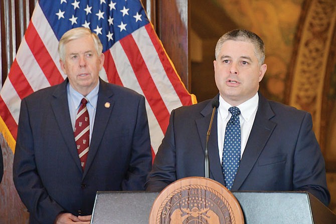 Missouri Department of Economic Development Director Rob Dixon speaks Friday, April 17, 2020, during a COVID-19 press briefing as Gov. Mike Parson looks on.