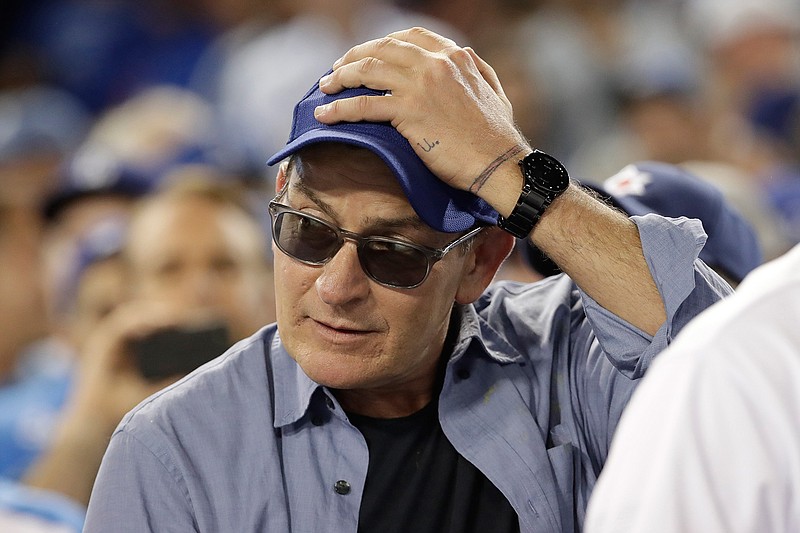  In this Oct. 19, 2016, file photo, actor Charlie Sheen reacts during the fifth inning of Game 4 of the National League baseball championship series between the Chicago Cubs and the Los Angeles Dodgers in Los Angeles. Sheen played Ricky "Wild Thing" Vaughn in the movie "Major League." The film was voted No. 8 in The Associated Press Top 25 favorite sports movies poll. (AP Photo/David J. Phillip, File)