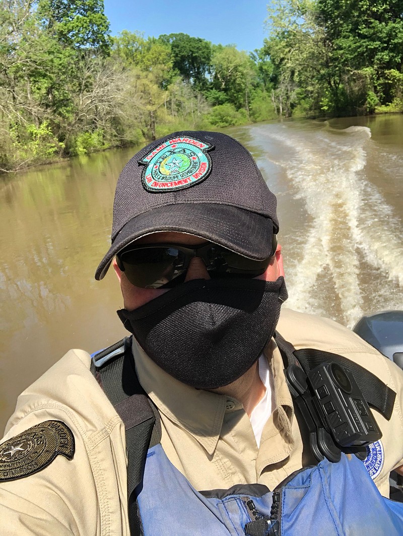 A Texas game warden wears a Mayo reusable mask as he patrols a state waterway. (Submitted photo)
