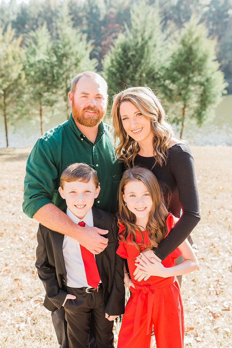 Krystal Dawn is the newly named Woman of the Year in Atlanta, Texas. She's pictured here with her husband, Joe Dawn and children Gunner and Halley. (SUBMITTED PHOTO)
