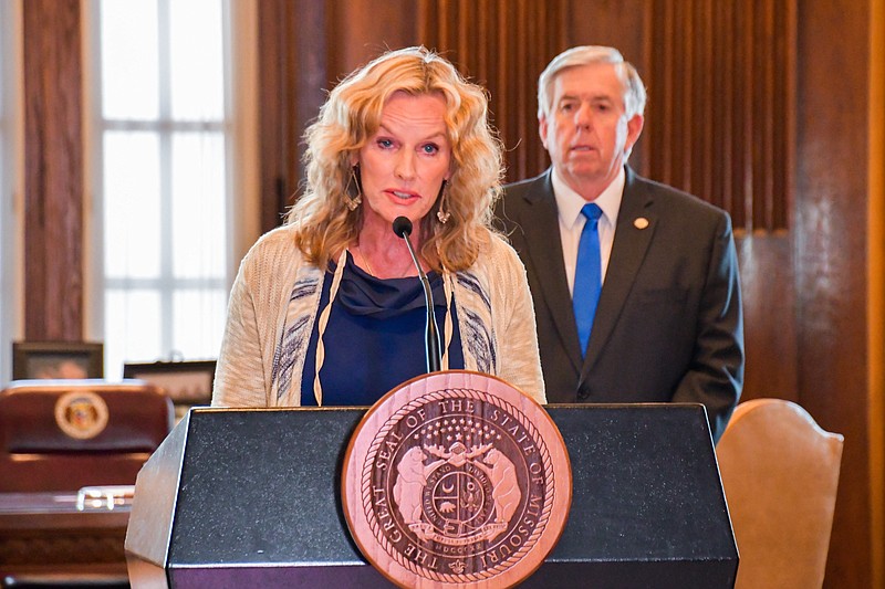 In this May 1, 2020 photo, Missouri Office of Administration Commissioner Sarah Steelman speaks during a COVID-19 briefing as Gov. Mike Parson looks on.