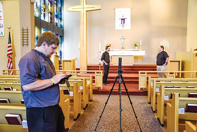 Trinity Lutheran School Athletic Director and coach Ryan Dubberke, left, has been using his technical skills to run the sound and video as pastors Sam Powell, background right, and Jesse Schlie conduct Sunday services to be streamed to parishioners. Since it is not known exactly when they'll be able to return for regular-but-social-distanced services, the trio has teamed up with the church music director provide as normal a religious service as possible.