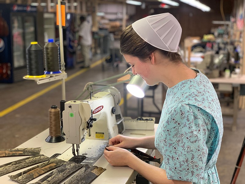 <p>Submitted</p><p>One of the Mennonite volunteers organized by Marcus Martin, of Tipton’s Martin Energy Group, works to sew a handmade face mask at the Gokey USA plant. Tipton’s Gokey plant has pivoted to manufacturing face masks during the past month, donating and selling masks to local facilities like Capital Region Medical Center and across the nation as far away as New York City.</p>