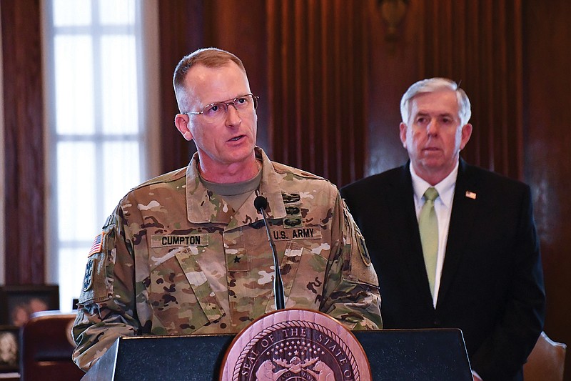 Missouri National Guard Adjutant Gen. Levon Cumpton speaks Wednesday during a COVID-19 briefing, as Gov. Mike Parson looks on.