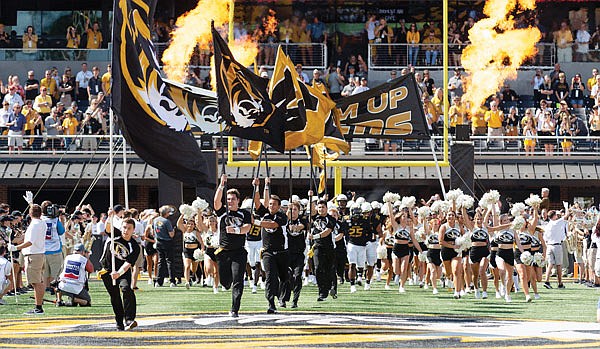 In this Sept. 7, 2019, file photo, the Missouri Tigers take the field before the start of an football game against West Virginia at Faurot Field.