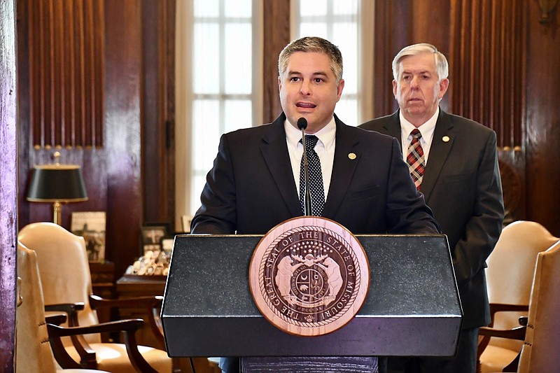 Missouri Department of Economic Development Director Rob Dixon speaks during a COVID-19 briefing Tuesday, May 12, 2020, as Gov. Mike Parson looks on.