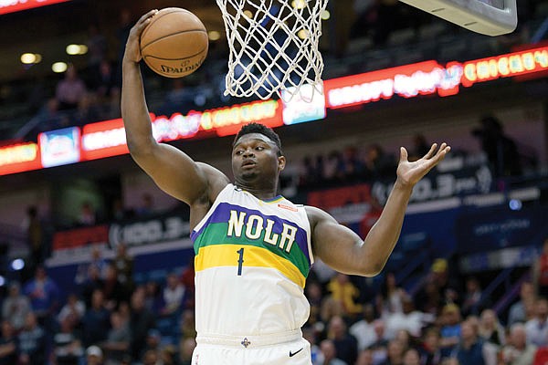 Pelicans forward Zion Williamson grabs a rebound during a game this season against the Thunder in New Orleans.