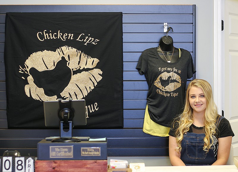 Liv Paggiarino/News Tribune

Nacona Gaona stands for a portrait in her boutique, Chicken Lipz, on Thursday, May 7, 2020 on Jefferson Street. The boutique has recently opened for business, and sells clothing, accessories, shoes, jewelry and more. 