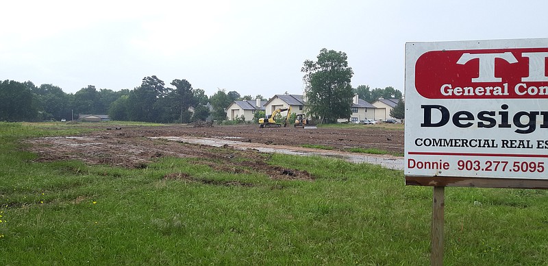 This cleared space at 2201 Arkansas Blvd. will soon be home to a new subdivision for families.
