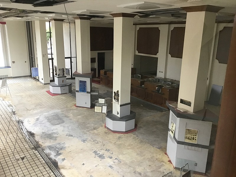 Part of the former Texarkana National Bank's original tile floor is slowly being revealed, along with other details as Texarkana Renewal Properties begins its rehabilitation.