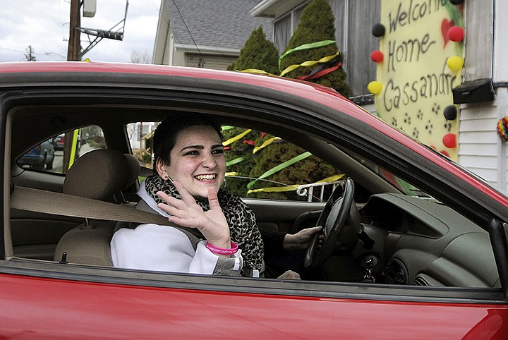  In this April 27, 2015 file photo, Cassandra Callender, arrives home with her mother in Windsor Locks, Conn., for the first time since December after a court-ordered chemotherapy for cancer treatment. Callender has died after a five-year battle with the disease, her mother said Thursday, May 14. She was 22. (Stephen Dunn/Hartford Courant via AP)