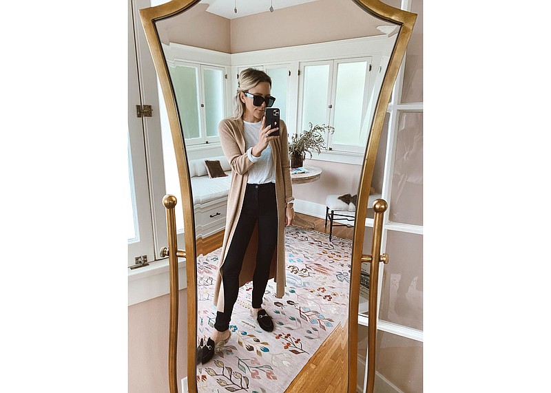 In this April 11, 2020 selfie photo by Jacey Duprie wears an outfit she featured in her fashion blog from her home in Los Angeles. After weeks stuck in isolation, bodies molded into beds and couches glued to TVs and computers, with little to delineate weekends from weekdays, a pronounced fashion trend is emerging in loungewear. (Jacey Duprie via AP)