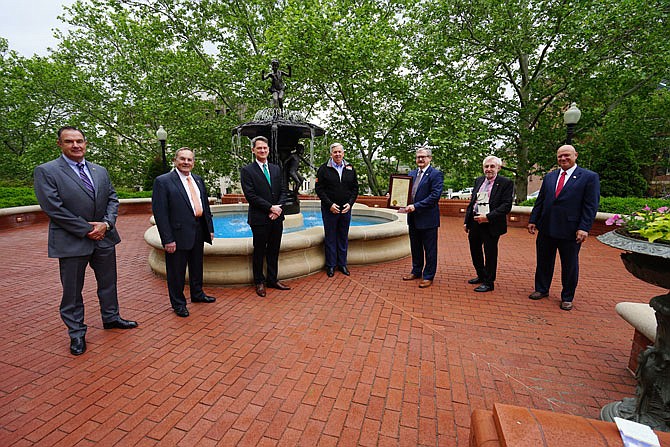 Pictured from left outside the Missouri Governor's Mansion are Lt. Gov. Mike Kehoe, state Rep. Dave Griffith, Cole County Bicentennial Committee Chair Marc Ellinger, Gov. Mike Parson, Cole County Presiding Commissioner Sam Bushman, state Rep. Rudy Veit and state Sen. Mike Bernskoetter.
