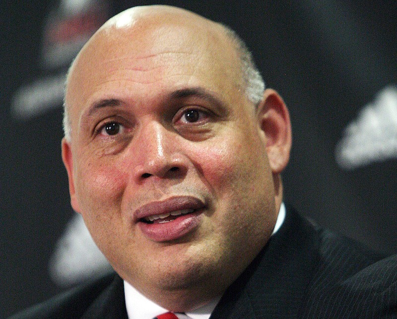 In this Tuesday, July 16, 2013, file photo, Sean Frazier fields questions from reporters after being introduced as the new athletic director at Northern Illinois University during a news conference, in DeKalb, Ill. In 2018, facing the possibility of cutting staff to make up a huge shortfall in state funding, Frazier added a football game at Florida State to Northern Illinois' schedule. The road trip came with a $1.6 million payout to NIU. (Rob Winner/Daily Chronicle via AP, File)